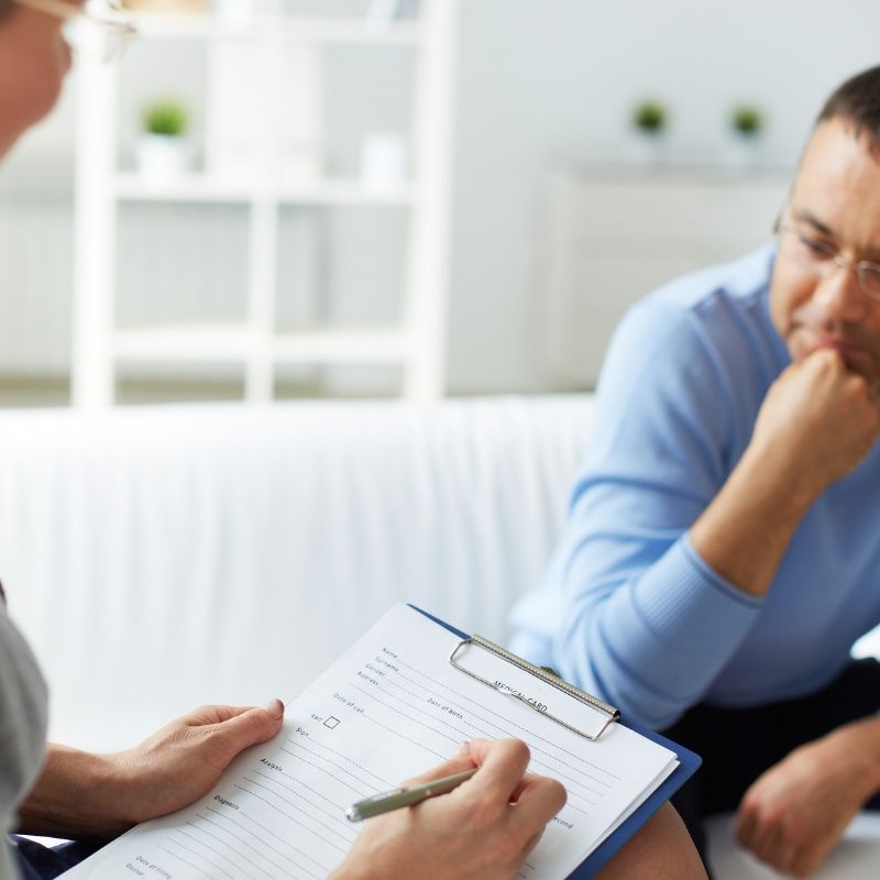 Teenager listening to therapist